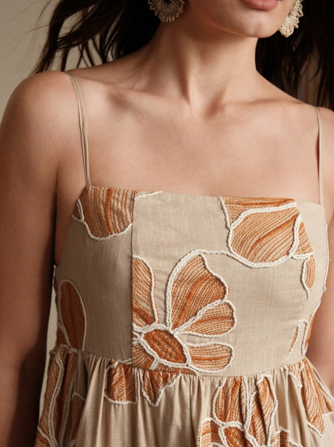 Long apricot dress with rope embroidery and fringes