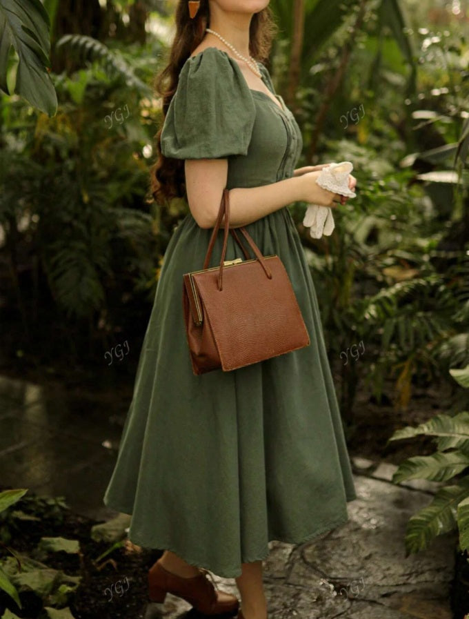 Green dress with puffed sleeves and Queen Anne neckline
