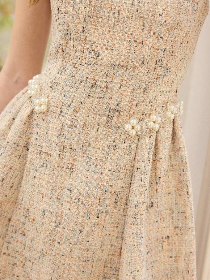 Speckled dress with ornate waistband